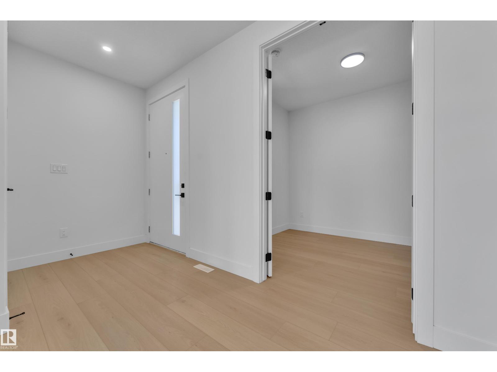 Representative front entry with glass-paneled door, at this finish level