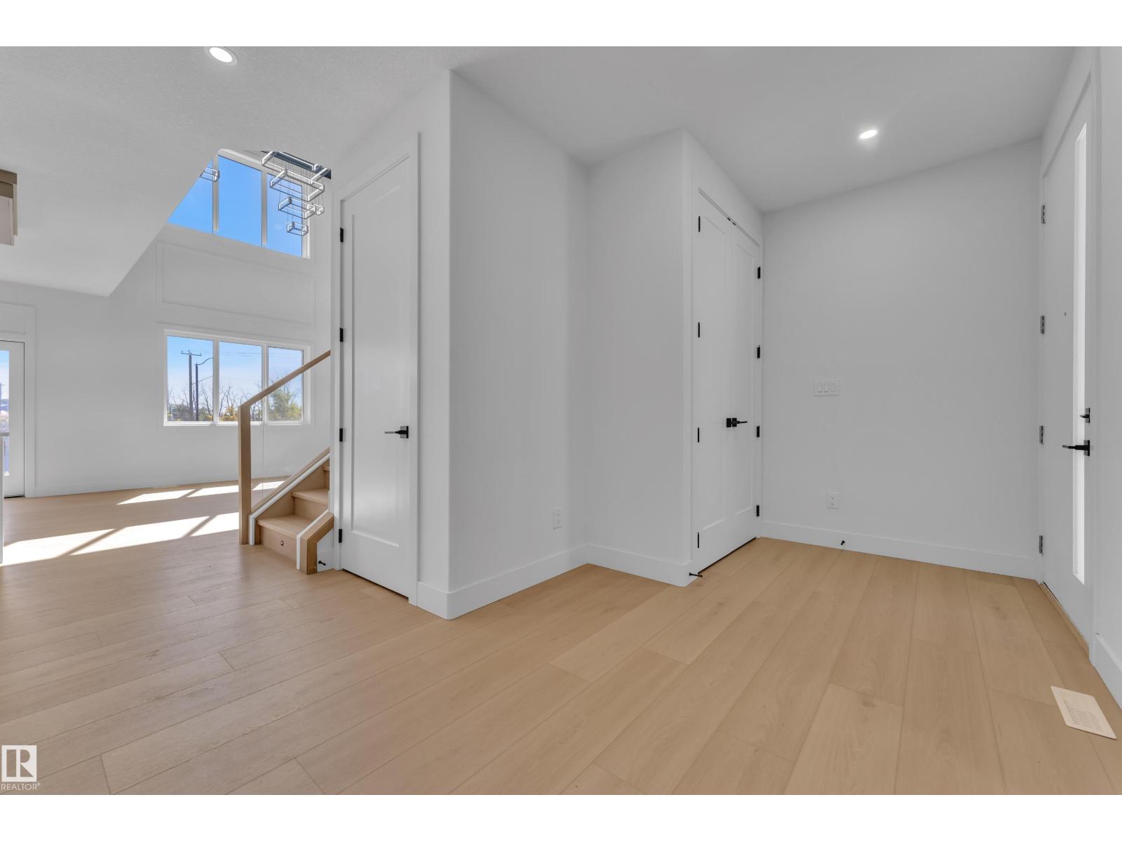Representative two-storey foyer with staircase, at this finish level