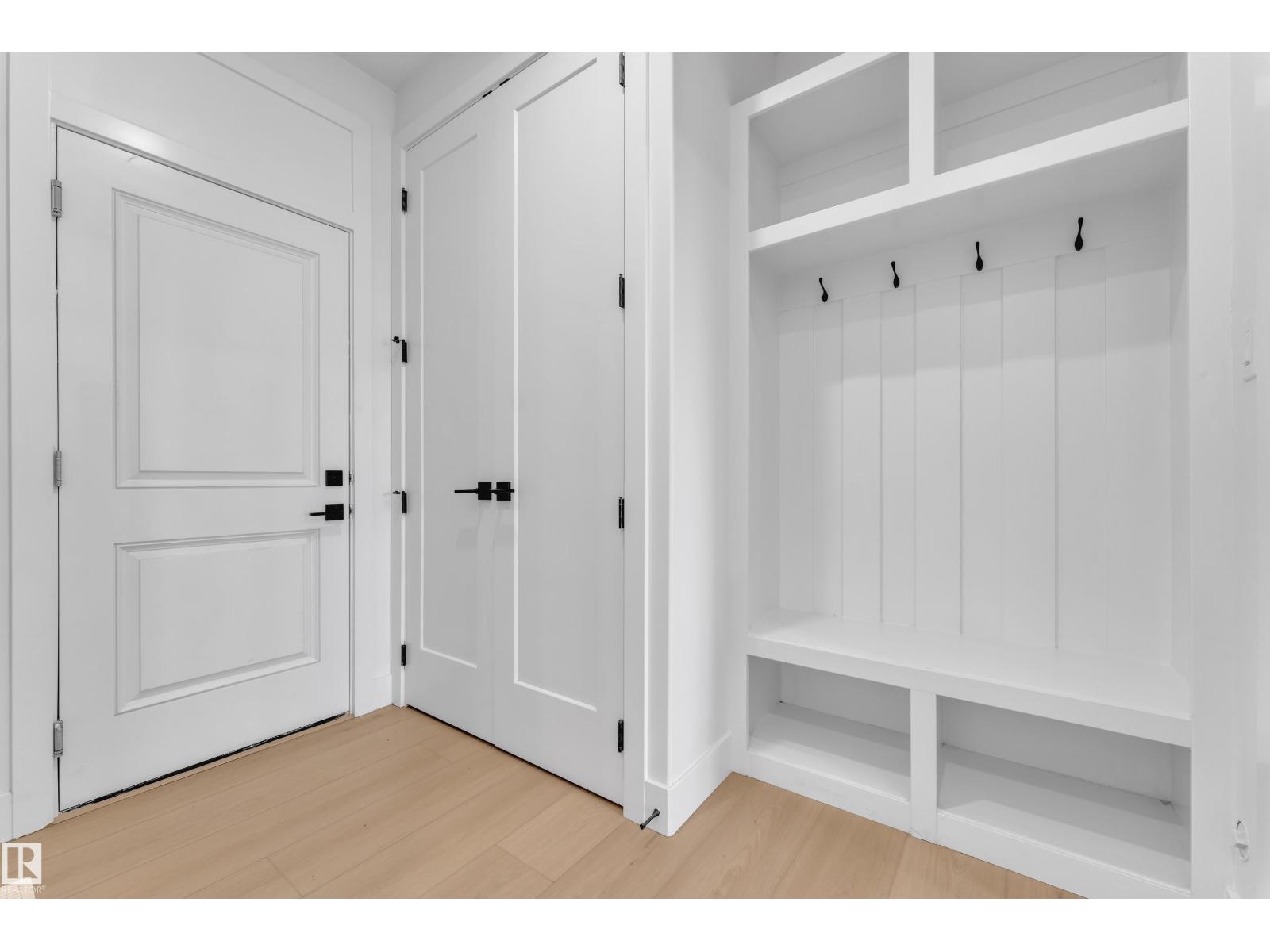 Representative mudroom built-in bench and hooks, at this finish level