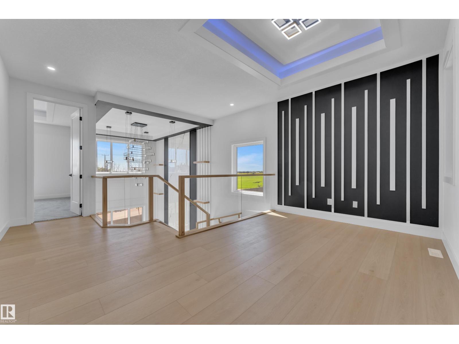 Representative upper landing with dark accent wall, at this finish level