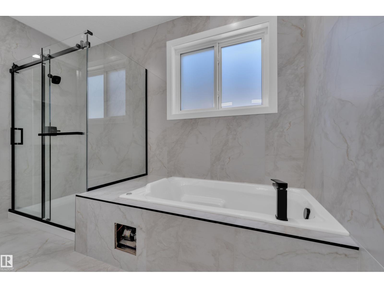 Representative primary ensuite with freestanding tub, at this finish level